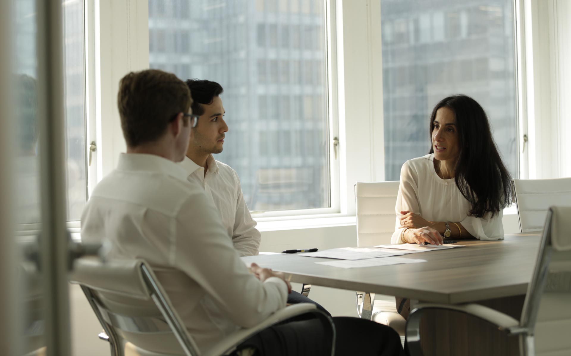 GreensLedge team members meeting in office